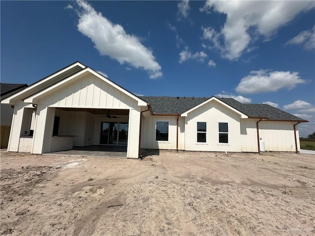 rear view of house featuring ceiling fan