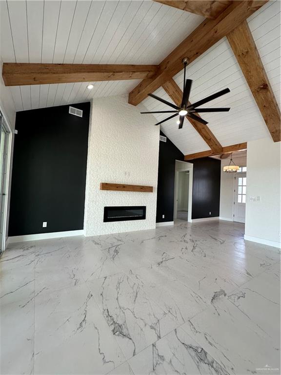 unfurnished living room with vaulted ceiling with beams, ceiling fan, and wood ceiling