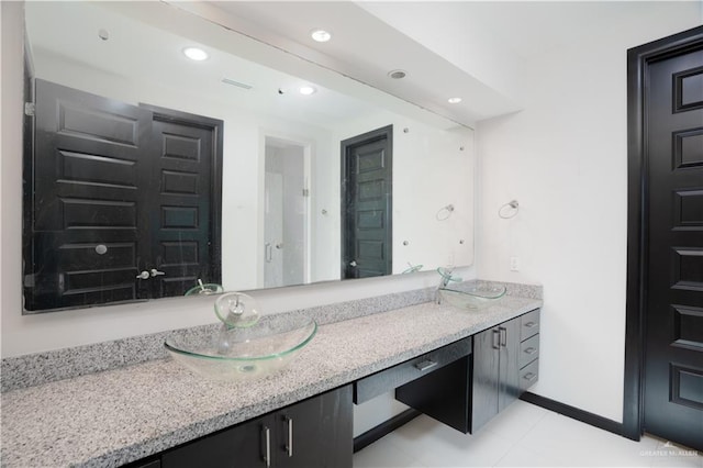 1916 N 46th St, Mcallen, TX 78501 - bathroom with double vanity, recessed lighting, tile patterned flooring, and baseboards