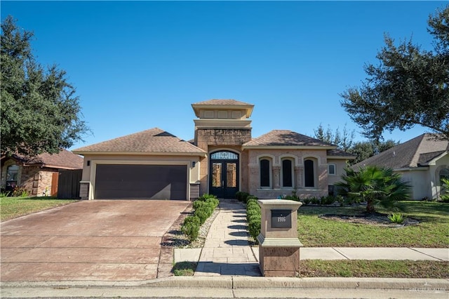1916 N 46th St, Mcallen, TX 78501 - mediterranean / spanish-style house with an attached garage, french doors, driveway, and stucco siding