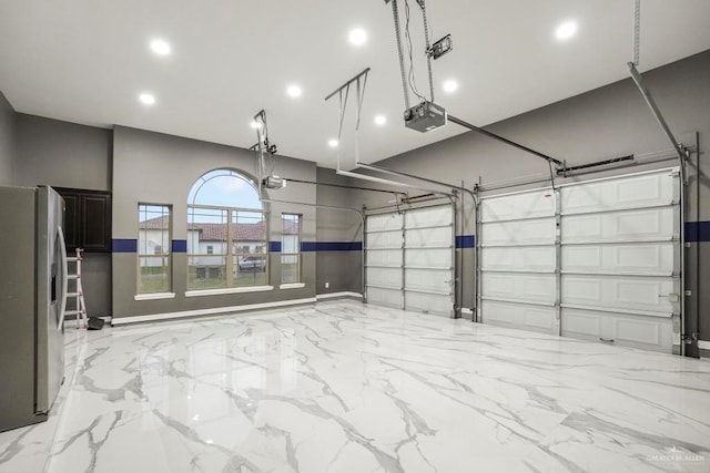 2806 S Woods Dr, Edinburg, TX 78542 - garage with recessed lighting, stainless steel refrigerator with ice dispenser, and a garage door opener