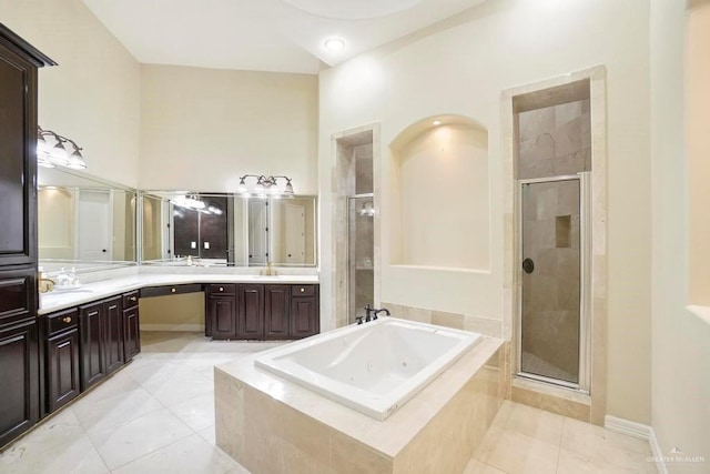 2806 S Woods Dr, Edinburg, TX 78542 - bathroom with baseboards, vanity, a stall shower, tile patterned flooring, and a whirlpool tub