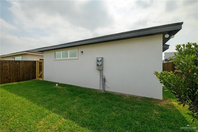 613 Cove Ln Unit 2, Weslaco, TX 78596 - view of side of home featuring stucco siding