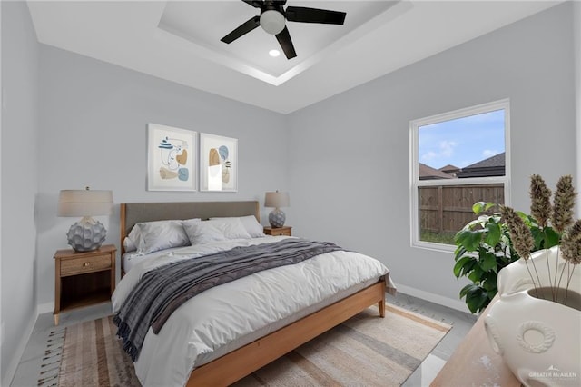3107 S Auburndale Ave, Edinburg, TX 78542 - bedroom featuring baseboards, a tray ceiling, recessed lighting, and a ceiling fan
