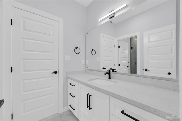 3107 S Auburndale Ave, Edinburg, TX 78542 - full bathroom featuring vanity, marble look tiles, and a stall shower