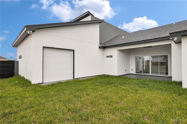 3107 S Auburndale Ave, Edinburg, TX 78542 - back of house with a lawn, a garage, and stucco siding