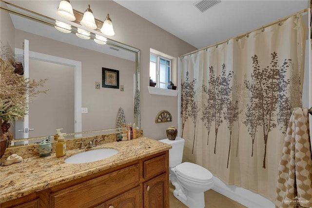full bath with tile patterned floors, vanity, a shower with curtain, toilet, and visible vents