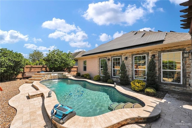 outdoor pool with a patio area and a fenced backyard