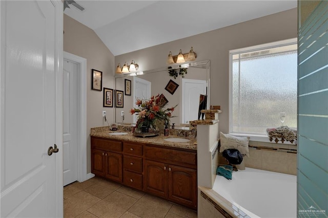 full bath with lofted ceiling, tile patterned floors, a sink, and double vanity