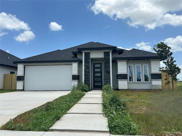 2108 Blue Sky Dr, Weslaco, TX 78599 - prairie-style house featuring an attached garage, driveway, and roof with shingles