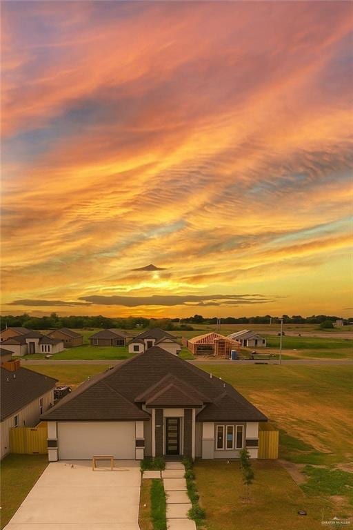 2108 Blue Sky Dr, Weslaco, TX 78599 - view of front of home featuring concrete driveway and a garage