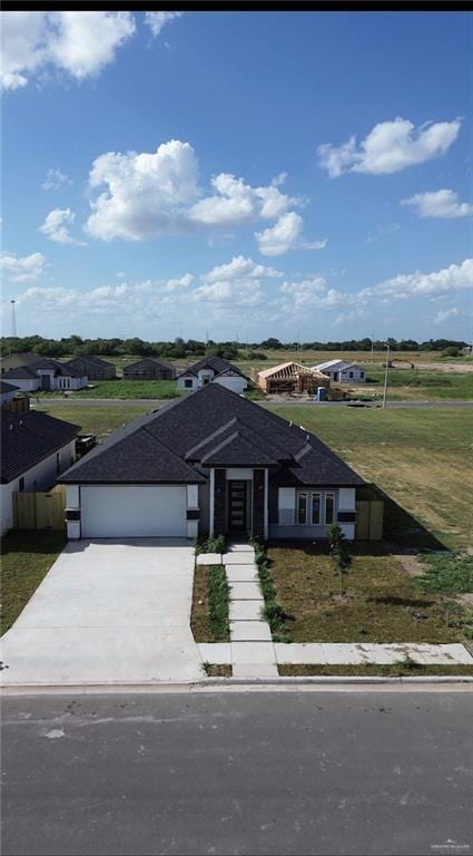 2108 Blue Sky Dr, Weslaco, TX 78599 - ranch-style home featuring concrete driveway and an attached garage