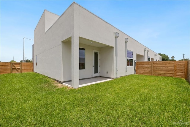 1220 N Lincoln Ave, San Juan, TX 78589 - rear view of property with a patio and stucco siding
