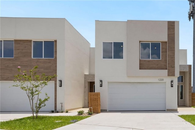 1220 N Lincoln Ave, San Juan, TX 78589 - view of front of home with a garage, driveway, and stucco siding