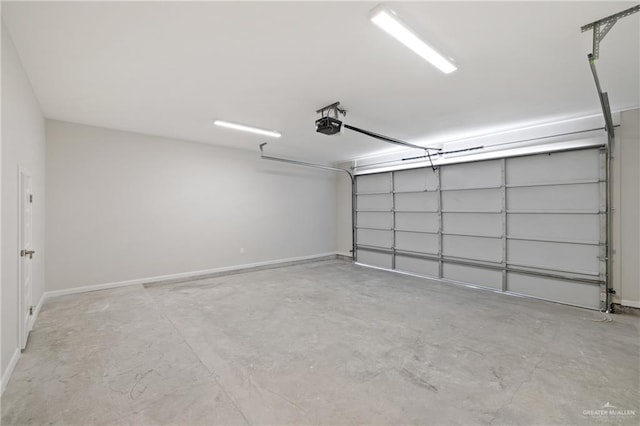 1220 N Lincoln Ave, San Juan, TX 78589 - garage featuring a garage door opener and baseboards