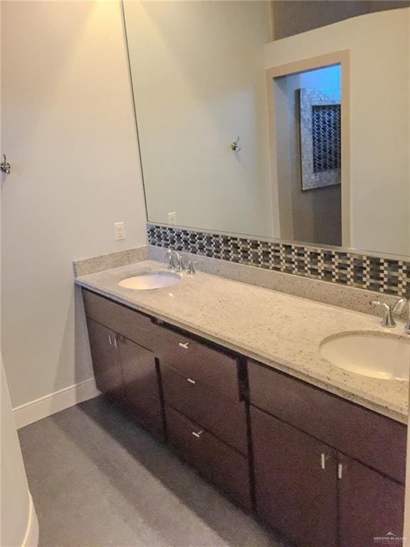 bathroom with backsplash and vanity