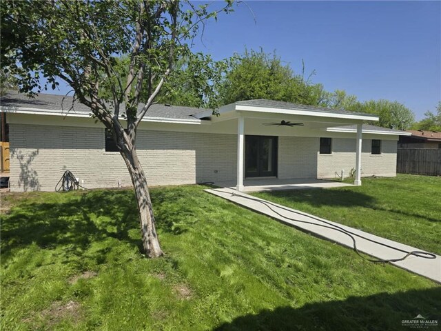 view of front of property with french doors, ceiling fan, and a patio area