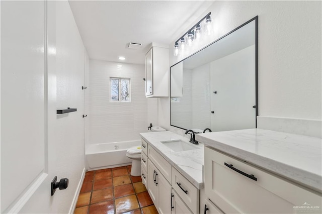 full bathroom with shower / tub combination, vanity, tile patterned flooring, and toilet