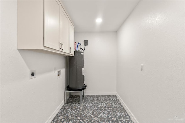 laundry room featuring cabinets, washer hookup, hookup for an electric dryer, and water heater