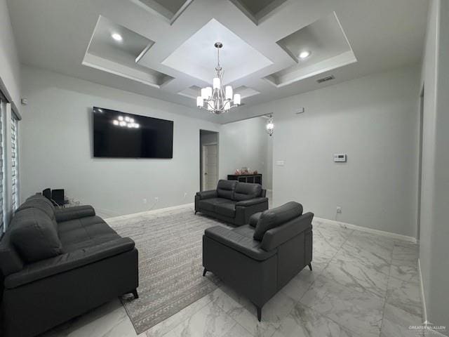 living room with coffered ceiling and a notable chandelier