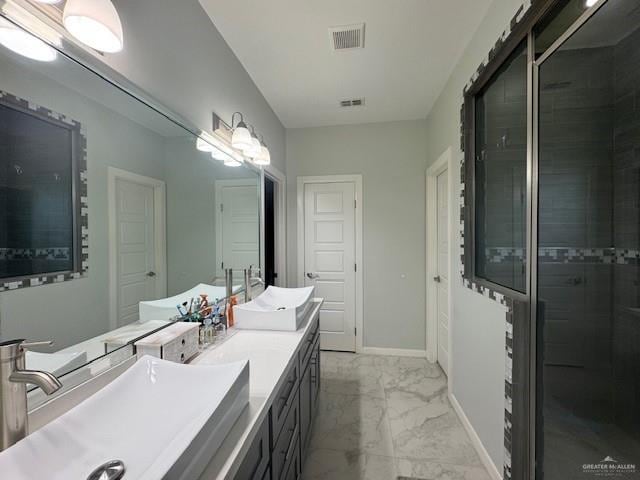 bathroom featuring vanity and an enclosed shower