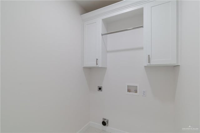 washroom with cabinet space, hookup for an electric dryer, baseboards, and washer hookup