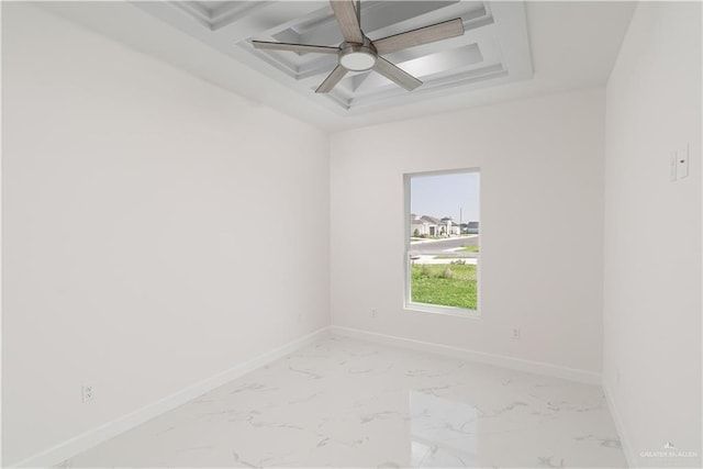 empty room with marble finish floor, beam ceiling, baseboards, ceiling fan, and coffered ceiling
