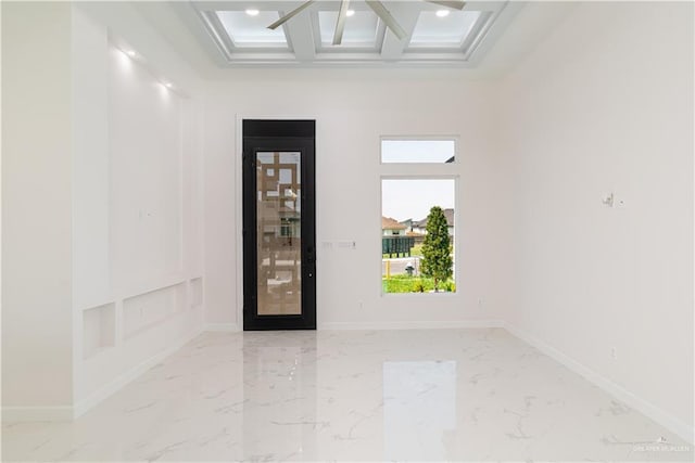 unfurnished room with beam ceiling, marble finish floor, recessed lighting, baseboards, and coffered ceiling