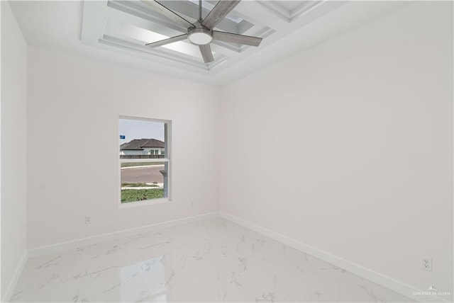 spare room with baseboards, marble finish floor, beam ceiling, and coffered ceiling