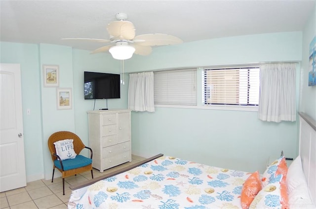 bedroom with light tile patterned flooring and ceiling fan