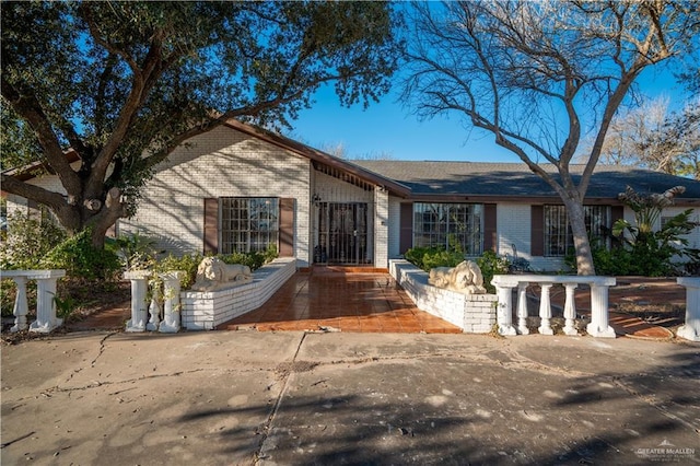 ranch-style house with brick siding