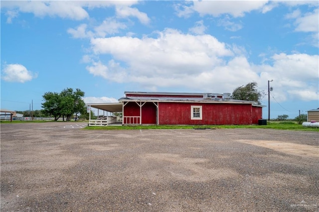 view of outbuilding with central air condition unit