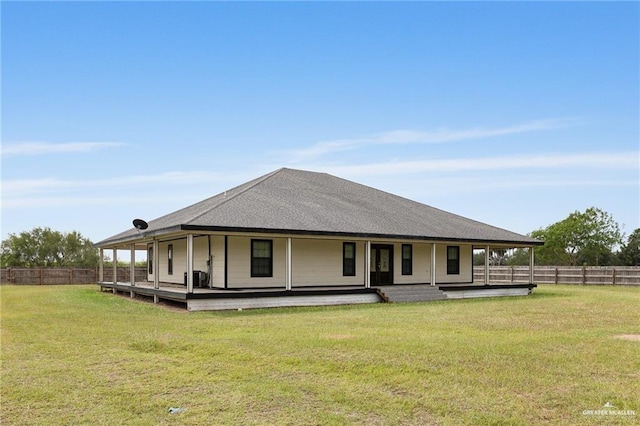 back of property featuring a lawn