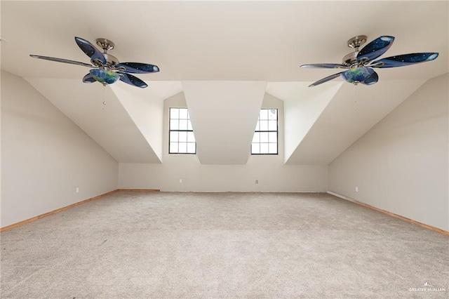 bonus room with ceiling fan, light colored carpet, and lofted ceiling