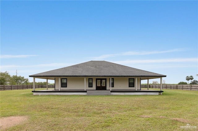 back of property featuring a lawn