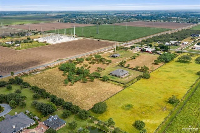 birds eye view of property with a rural view