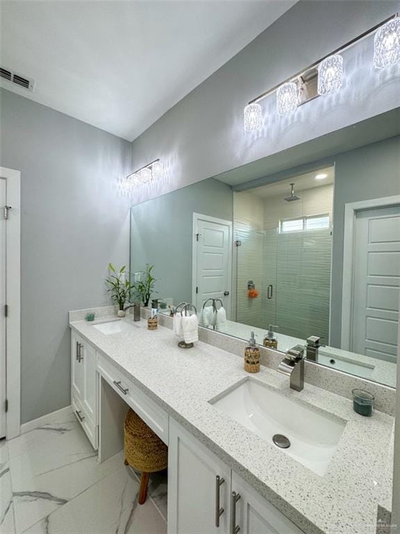 1313 W Dawes Ave W, Alton, TX 78573 - bathroom featuring double vanity, a stall shower, and marble look tiles