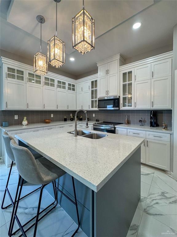 1313 W Dawes Ave W, Alton, TX 78573 - kitchen with appliances with stainless steel finishes, a chandelier, a sink, recessed lighting, and backsplash