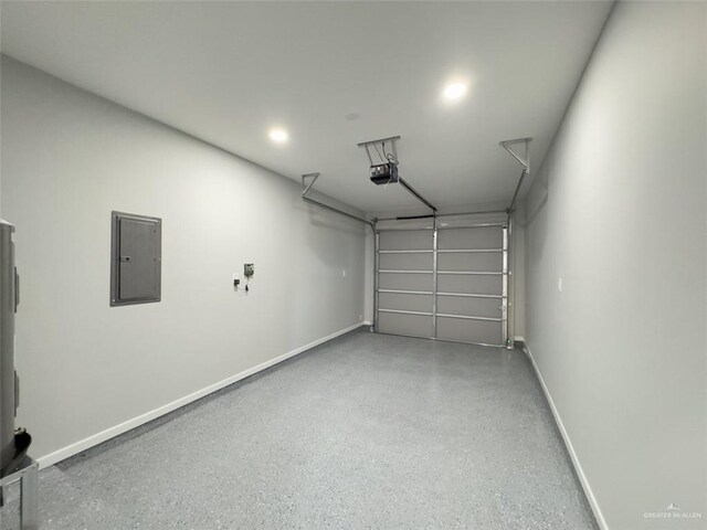 1313 W Dawes Ave W, Alton, TX 78573 - garage featuring electric panel, a garage door opener, and baseboards