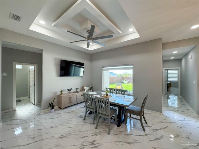 1313 W Dawes Ave W, Alton, TX 78573 - dining area featuring a tray ceiling, baseboards, recessed lighting, light marble finish floors, and a ceiling fan