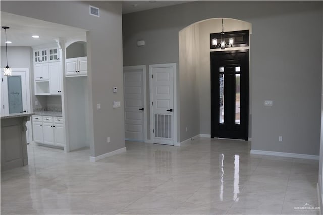 foyer with a notable chandelier