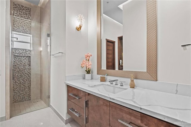 bathroom featuring tile patterned flooring, vanity, and an enclosed shower