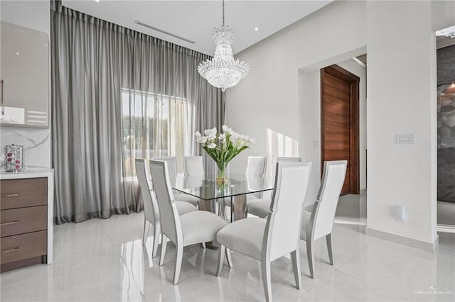 dining room with a notable chandelier