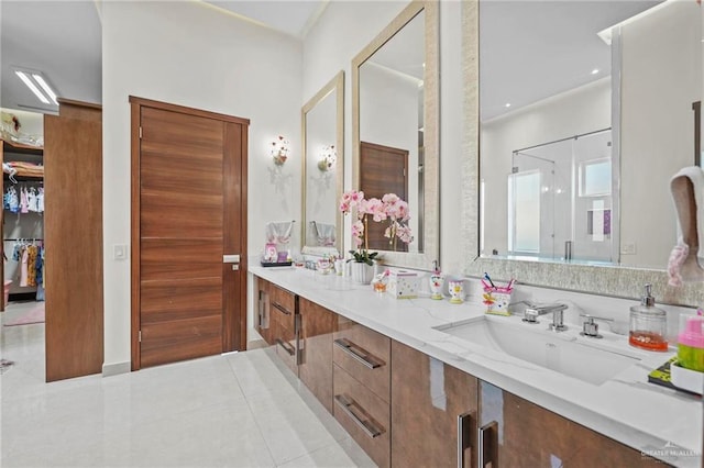 bathroom with tile patterned flooring and vanity