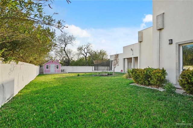 view of yard with a trampoline