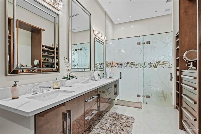 bathroom with tile patterned flooring, vanity, and a shower with shower door