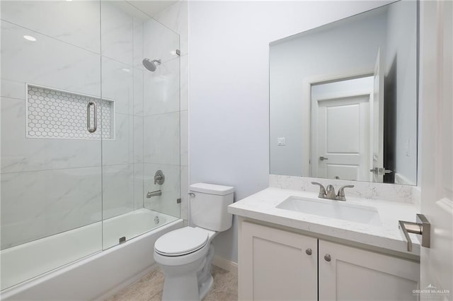 full bathroom featuring vanity, toilet, and bath / shower combo with glass door