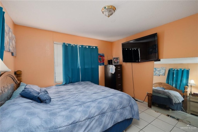 bedroom featuring light tile patterned flooring