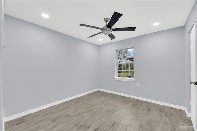 unfurnished room featuring light hardwood / wood-style floors and ceiling fan