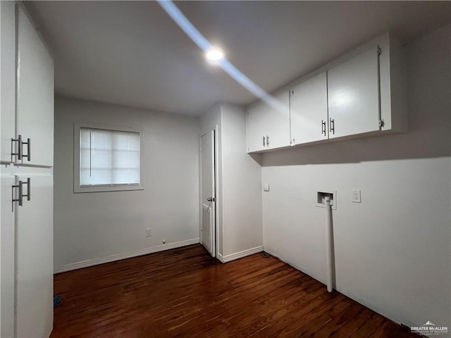 washroom with cabinets, dark wood-type flooring, and washer hookup